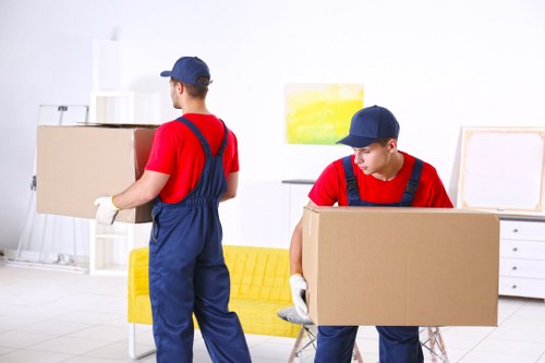 Professional removals team planning a move in busy Soho streets