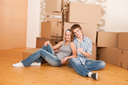 Packed moving boxes and furniture prepared for a Soho relocation