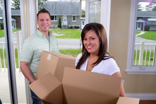 Professional movers handling boxes and furniture in Soho