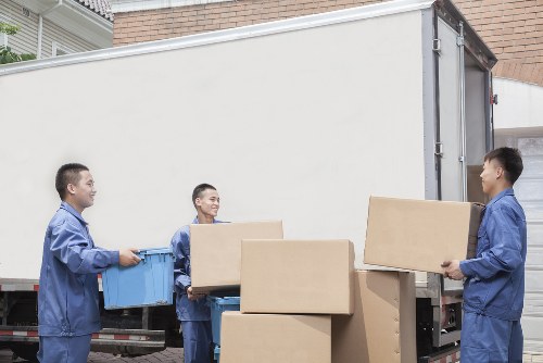 Man with van service helping with a move in Soho's busy central streets