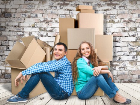 Packed commercial boxes and furniture ready for transport in Soho