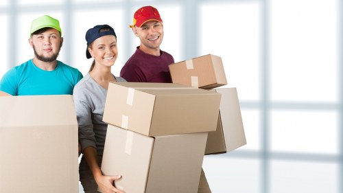 Furniture removal crew loading items for residential and commercial customers in Soho